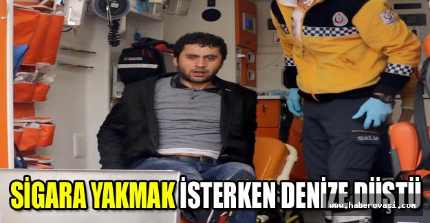 Sigara yakmak isterken denize düştü